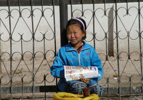 CLICK ON PHOTO FOR ENLARGEMENT - Newspaper and Pine Nut vendor