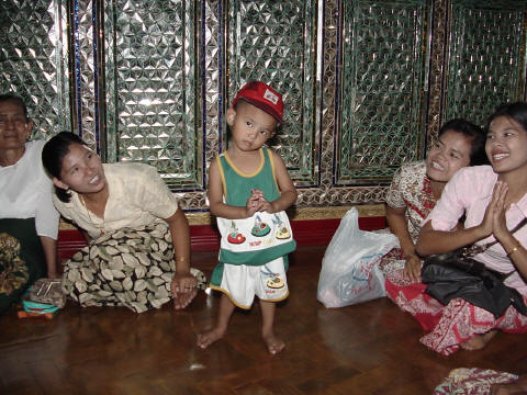 Child learning to pray at Yangon temple- Click For Full-Size Photo