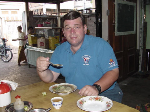 Foreigner enjoys Mohinga, famous Myanmar breakfast - Click For Full-Size Photo