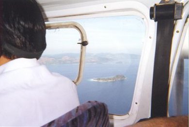 View of Dimikya Island (small one).  Busoanaga Island in background.